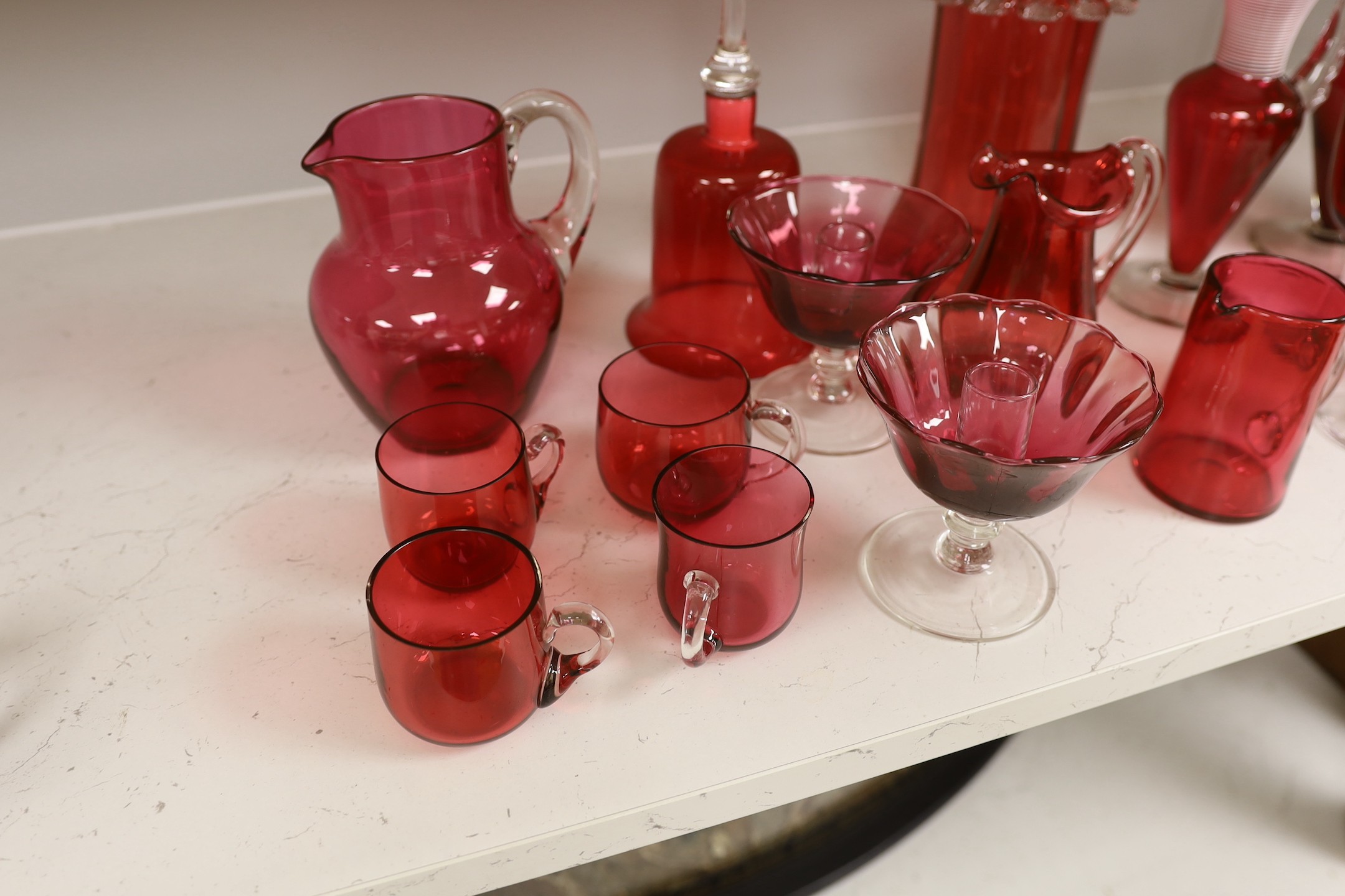 A quantity of various late 19th/early 20th century cranberry glass
